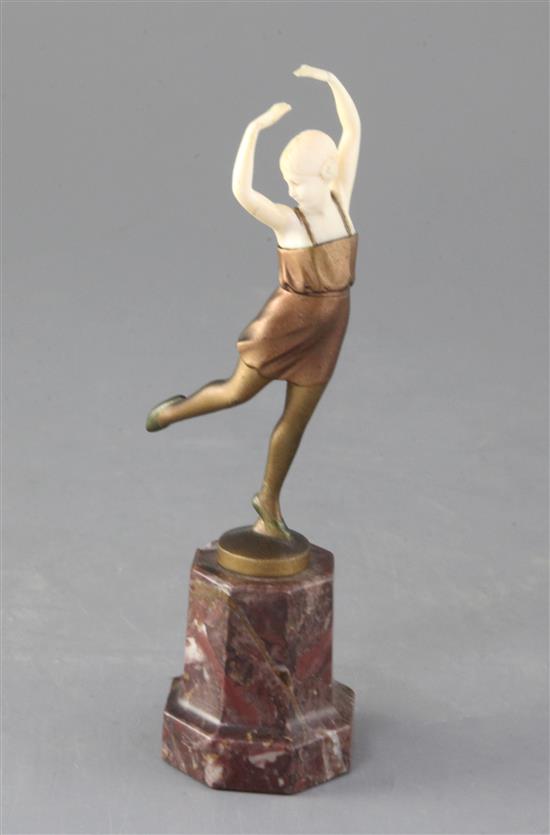 An Art Deco ivory and cold patinated bronze figure of a dancing girl, height 7in.